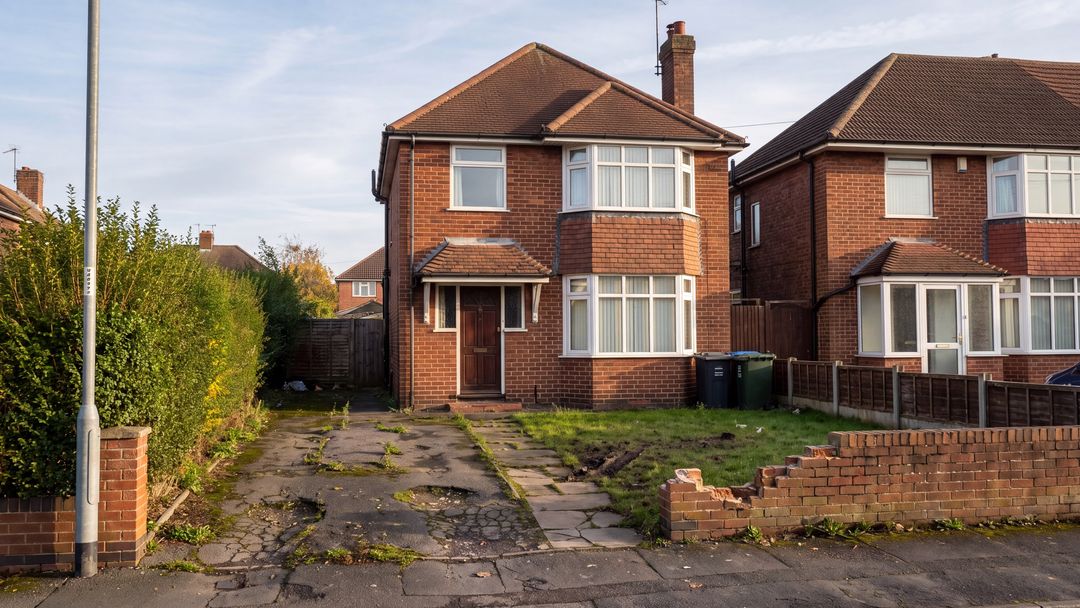 Before: the front of a 1930s red-brick semi with a cracked tarmac drive, a patchy lawn and a crumbling front wall.